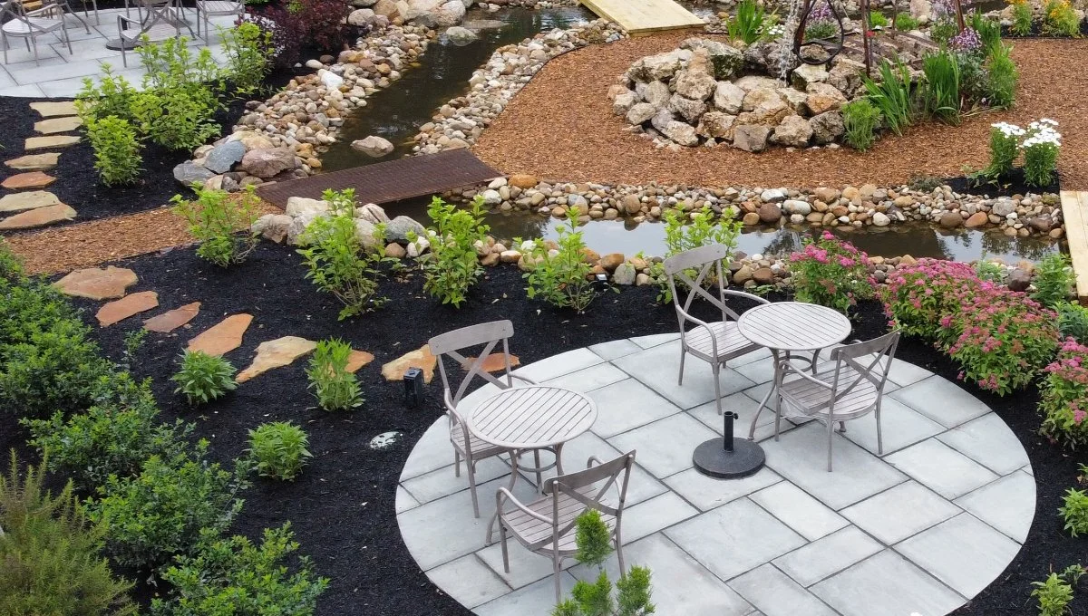 Patio area with a walkway and water features in Huron, OH.