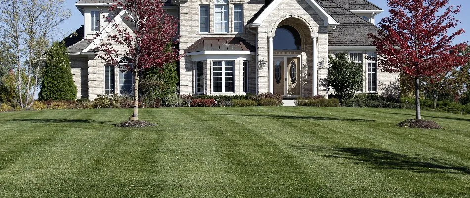 Mowed lawn with trees and shrubs in Huron, OH.